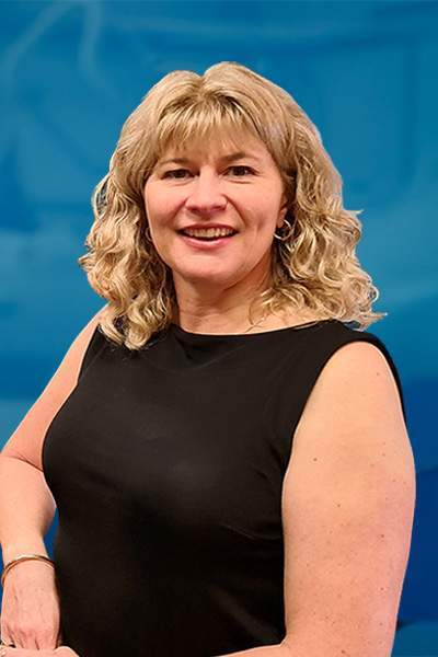 Farewell to Tammy Halter, Pennant’s Director of Technology & Innovation 1 A person stood smiling in front of a blue background. The person is wearing a dark outfit.