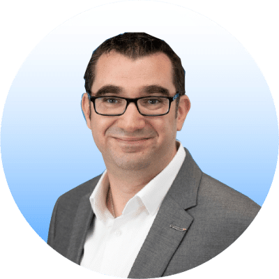 Why Working Groups and Committees are important 2 A photo of a man, Rob Acton, with dark hair and glasses, wearing a shirt and blazer, smiling.