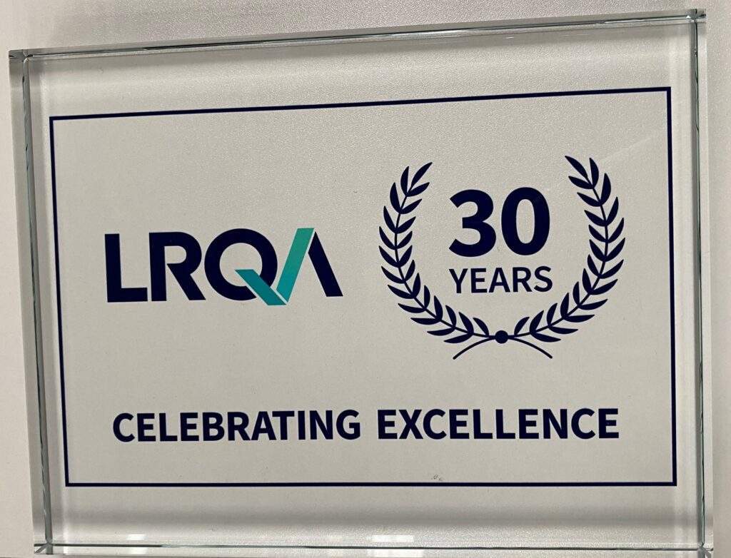 Celebrating 30 Years of LRQA Certification 29 A glass plaque with the blue LRQA logo and a crest with 30 years written inside