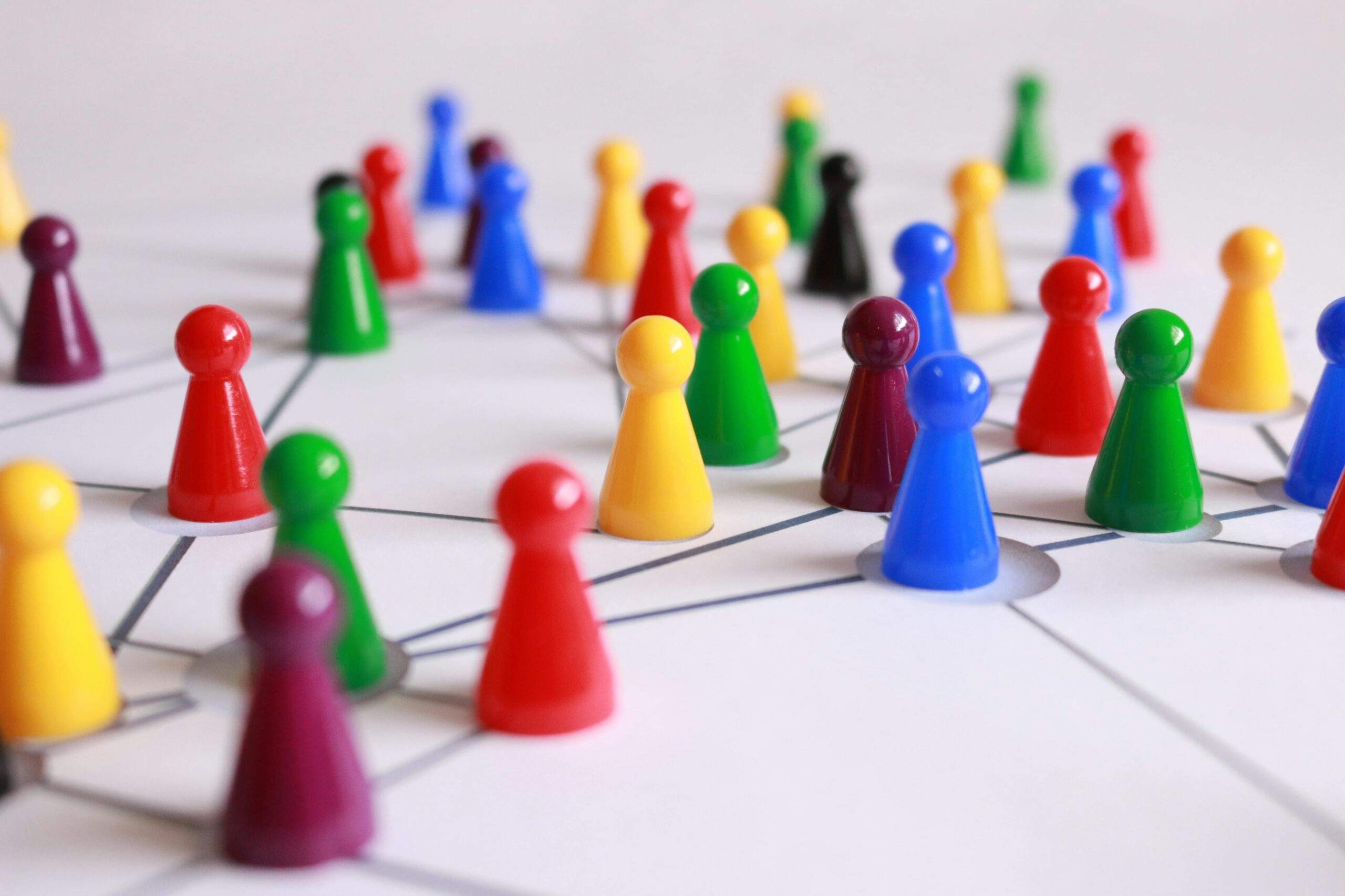 Why Tool Design & simplicity matter more than ever 2 multi coloured pins on a framework pattern